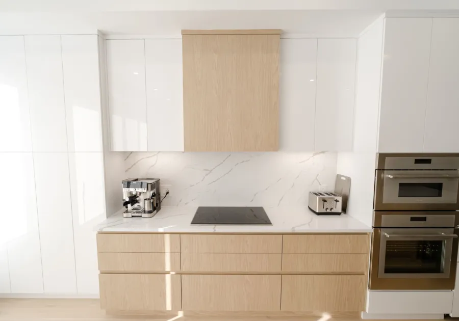 Built-in coffee machine set into kitchen cabinetry