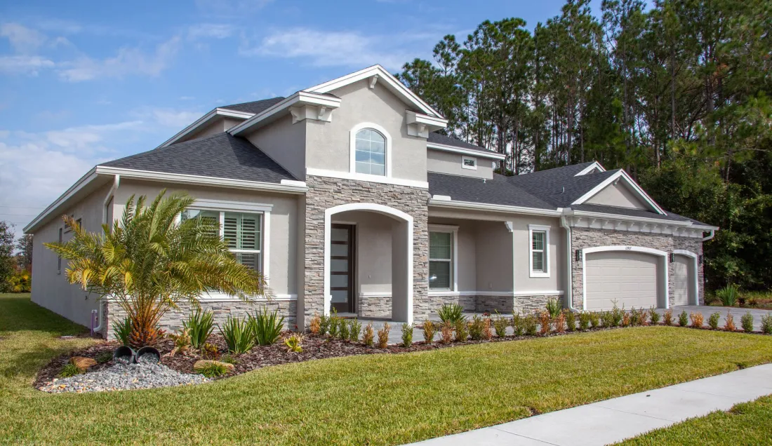 Modern family home with a wide driveway at dusk